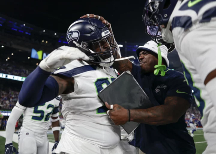 Rookie Devon Witherspoon scores on 97-yard pick six as Seahawks D leads Seattle over Giants