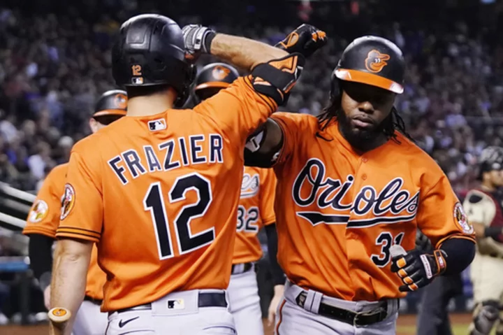 Mullins hits a 3-run homer to start a six-run inning, leading Orioles past the Diamondbacks 7-3