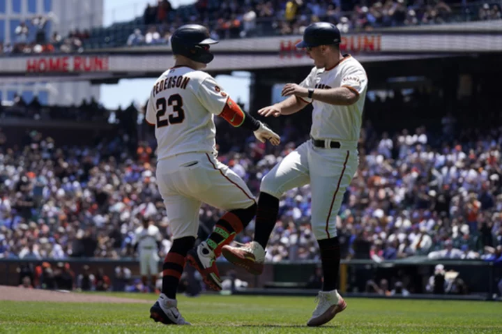 Pederson, Estrada homer, SS Crawford pitches as Giants rout Cubs 13-3