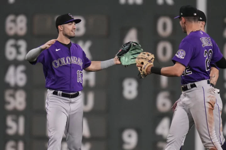 Grichuk's 2-run double in 10th lifts Rockies over Red Sox 7-6