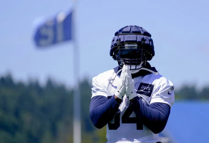 Rookie Devon Witherspoon unsigned and absent from start of Seahawks camp