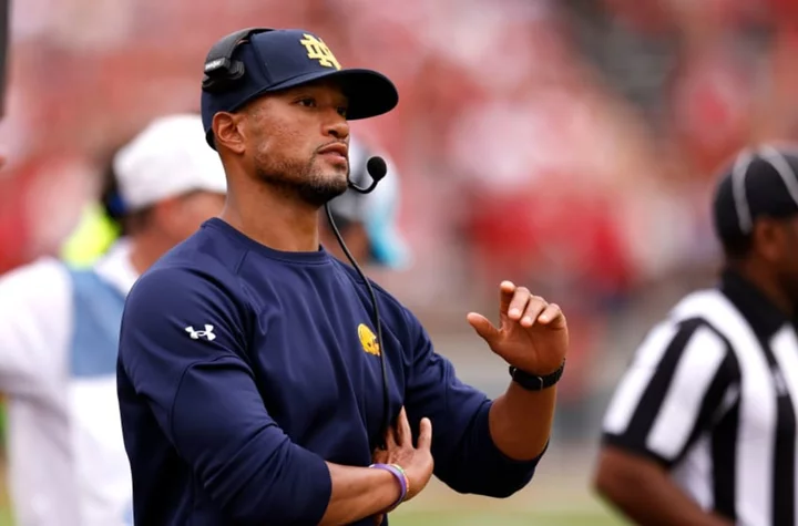 Notre Dame coaches spent rain delay like many fans: At the concession stands