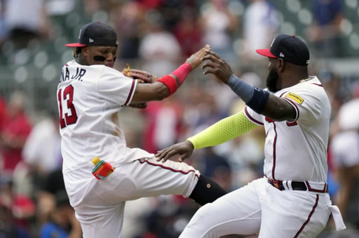 Olson 31st, 32nd homers, Riley's 3-run drive lead Braves over Diamondbacks 7-5