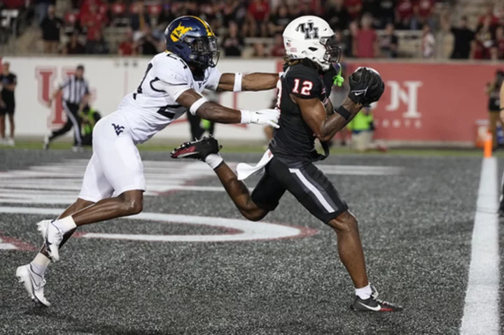 49-yard Hail Mary as time expires helps Houston beat W. Virginia 41-39, get 1st Big 12 win