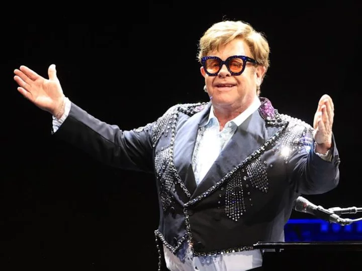 Elton John serenaded by Manchester City players at airport in FA Cup celebrations