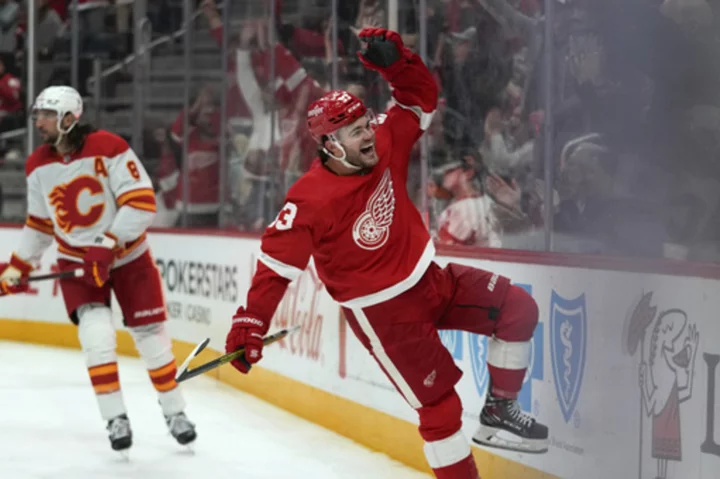 DeBrincat scores 3 goals as Red Wings beat Flames for 5th straight win