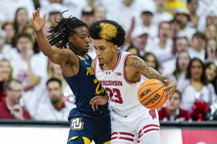 Klesmit scores 21 in 1st half, Wisconsin outrebounds No. 3 Marquette in 75-64 win