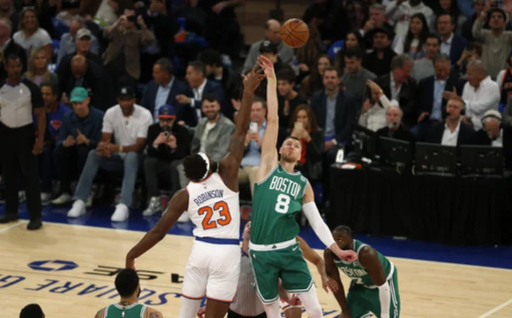 Porzingis makes tiebreaking 3-pointer in strong Celtics debut, helps Boston beat Knicks 108-104