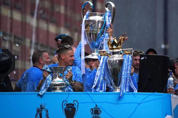 Rain and threat of lightning fail to dampen Manchester City’s trophy parade