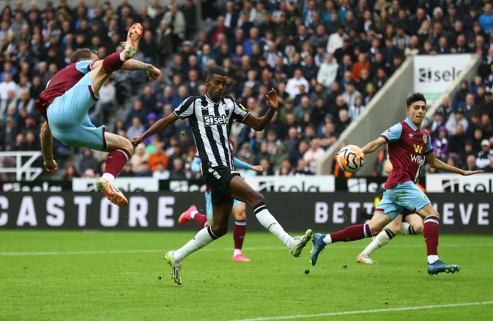 Soccer-Almiron, Isak score as Newcastle see off Burnley