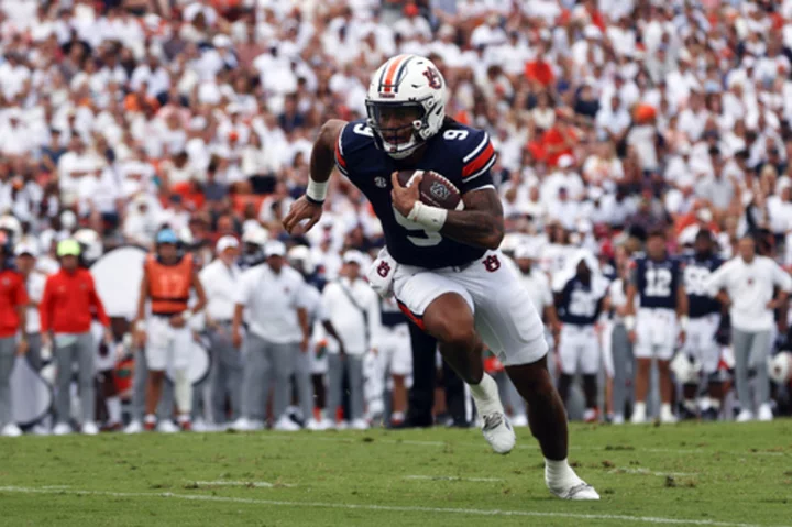 Robby Ashford runs for 3 touchdowns and Hugh Freeze gets win in debut as Auburn's head coach 59-14