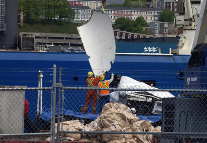 Debris from implosion of Titanic-bound submersible is returned to land