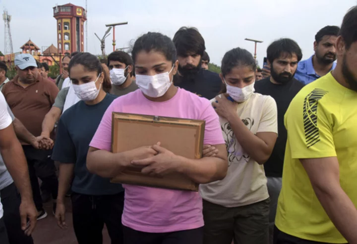 Indian wrestlers delay plan to throw medals into Ganges River as part of sexual abuse protest